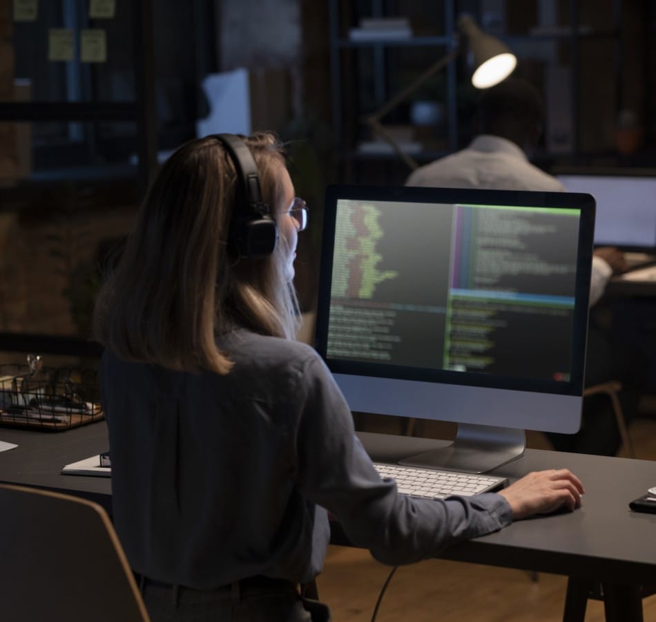 Threat Intelligence person working on computer